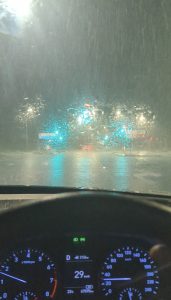 POV photo of driving a car at 29kph in heavy rain